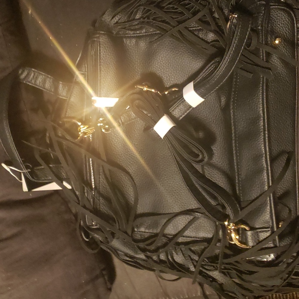 Black fridge with gold hardware bikers jacket back pack.brand new.tags on.